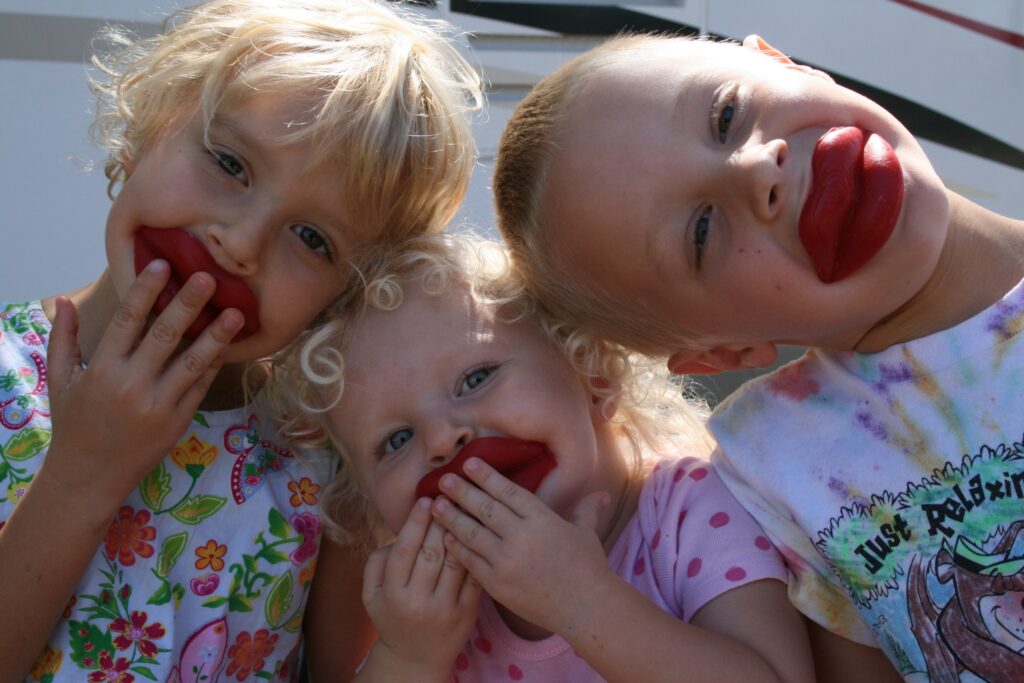 three children with waxed lips