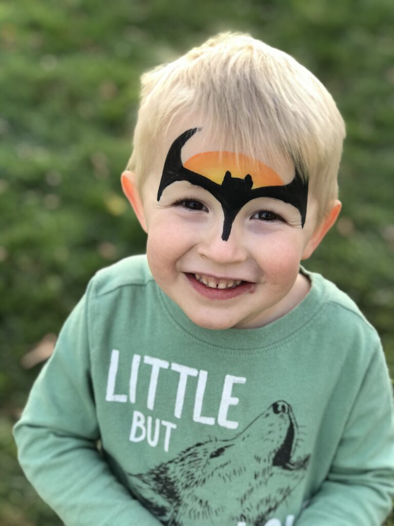 little boy with his face painted