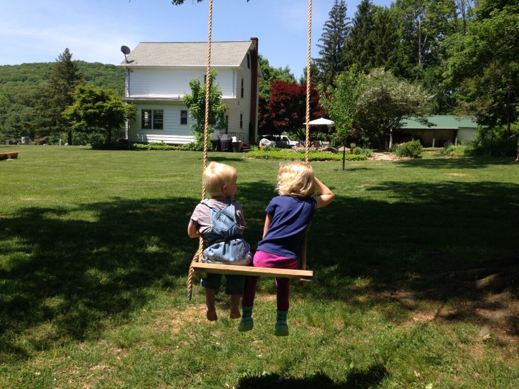 boy and girl on a swing