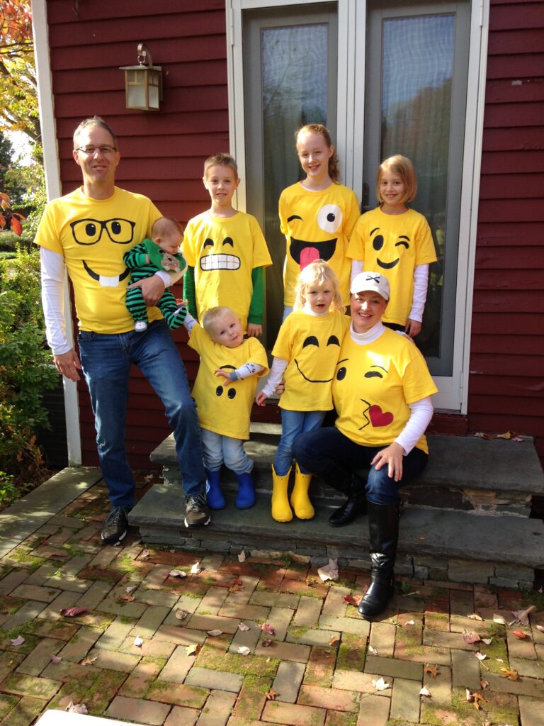 family wearing yellow emoji shirts