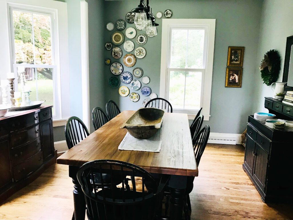 dining room table with plate wall