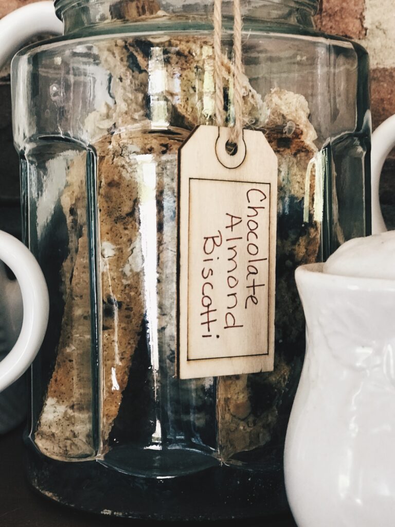 a biscotti jar with a gift label up close