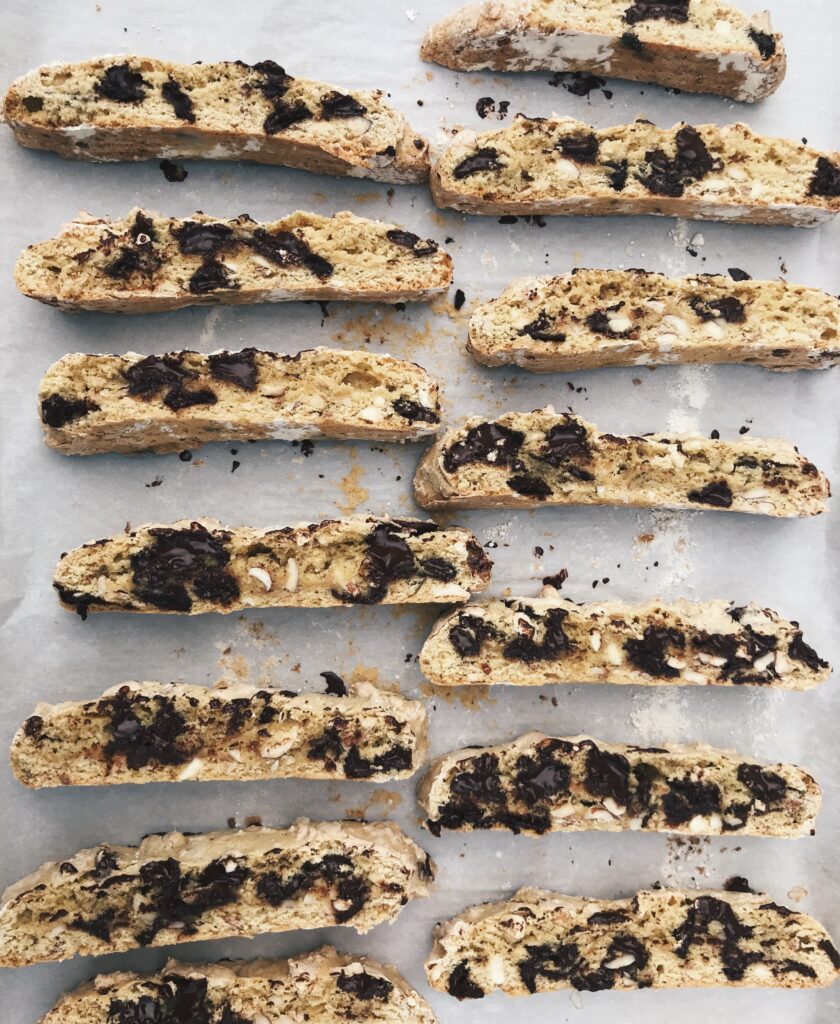 cut chocolate almond biscotti on a cookie sheet from above