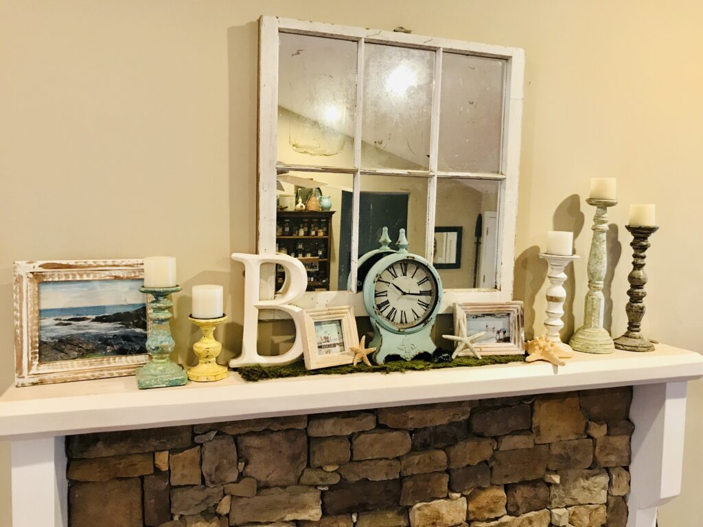 summer mantle with clock, candles, and pictures
