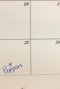 a calendar with the 25th marked peppers