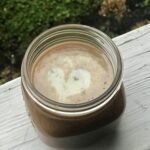 a jar of caramel sauce on the porch