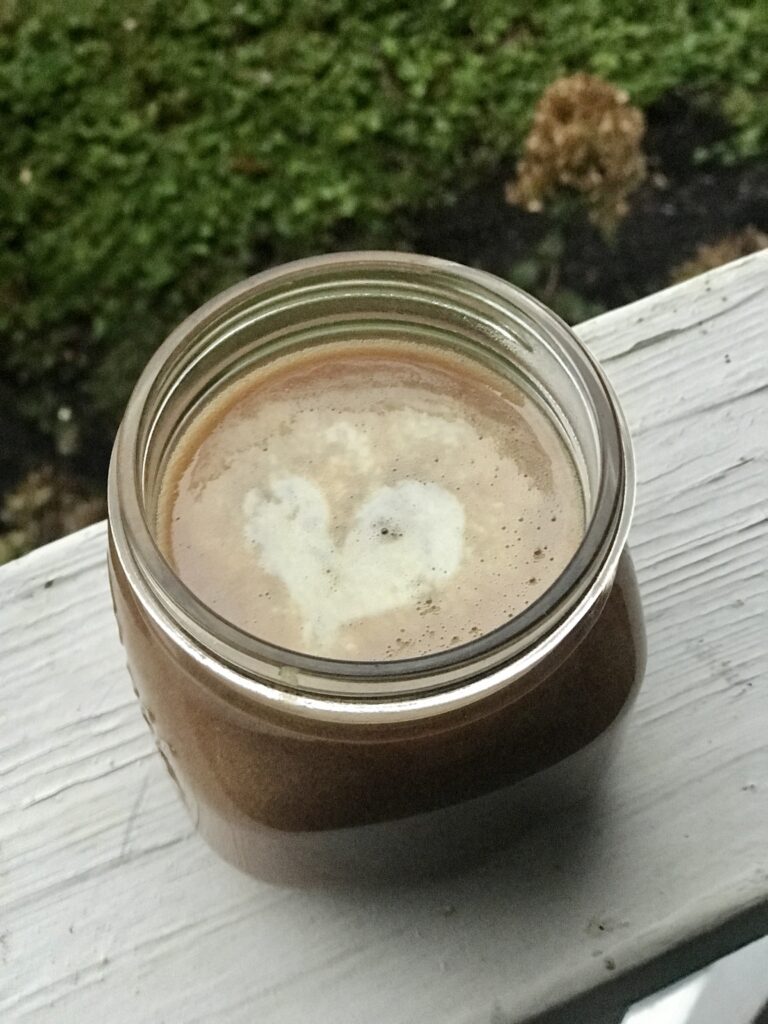 a jar of caramel sauce on the porch