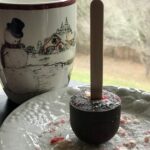 snowman mug with a hot chocolate on a stick