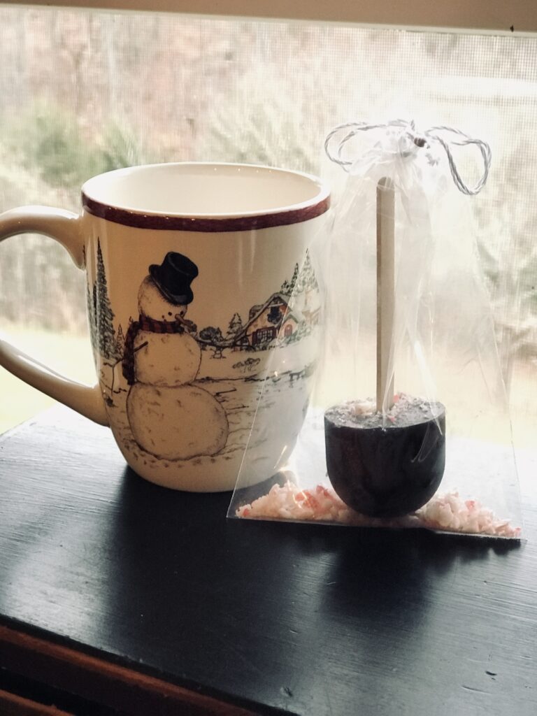 mug with hot chocolate on a stick with gift bag