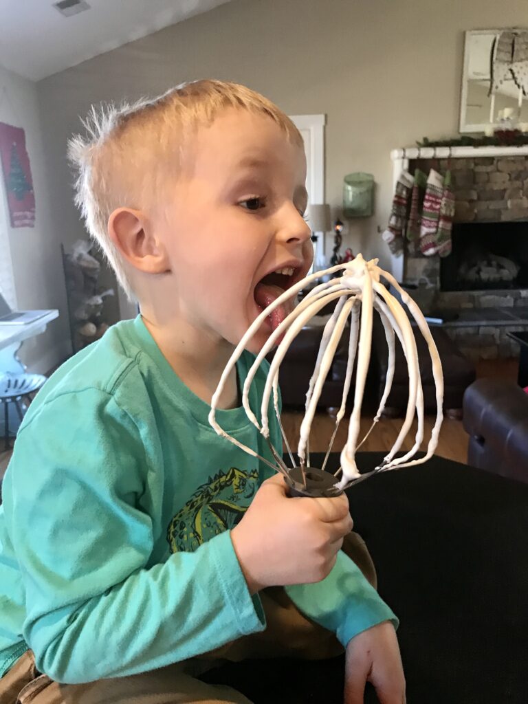 boy licking the beater