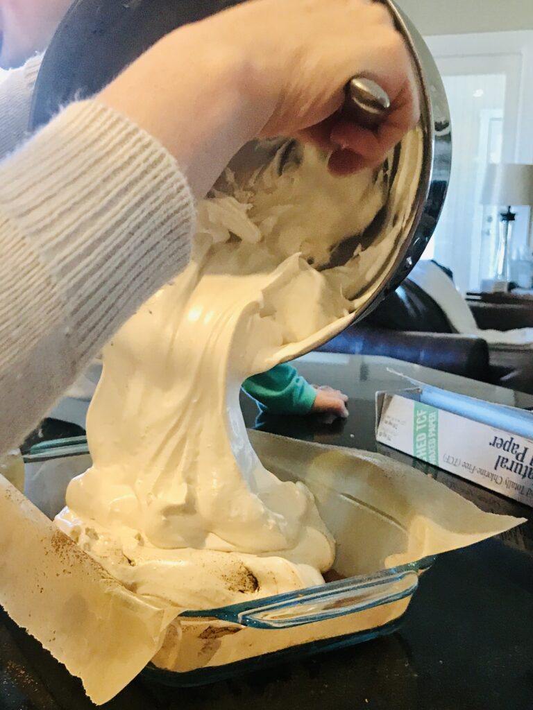 pouring marshmallow into pan