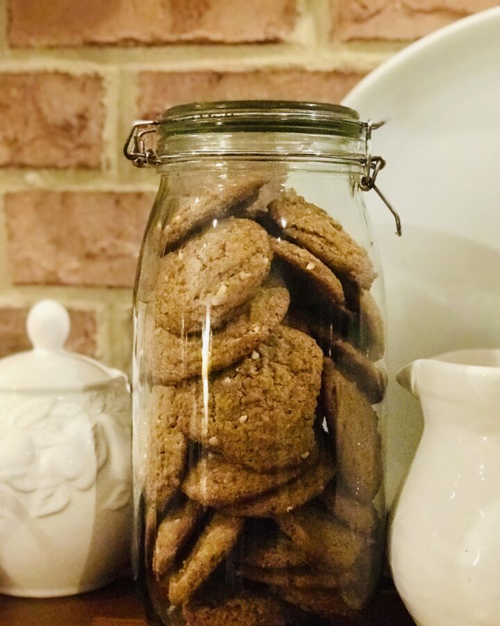 jar of peanut butter cookies by white pitchers