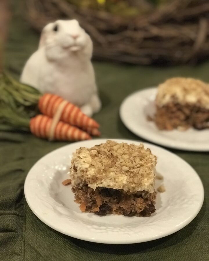 spiced carrot cake with bunny and carrots in the background