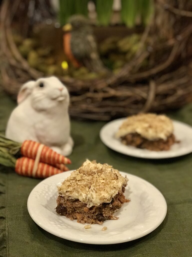 spiced carrot cake with bunny and bird basket in background