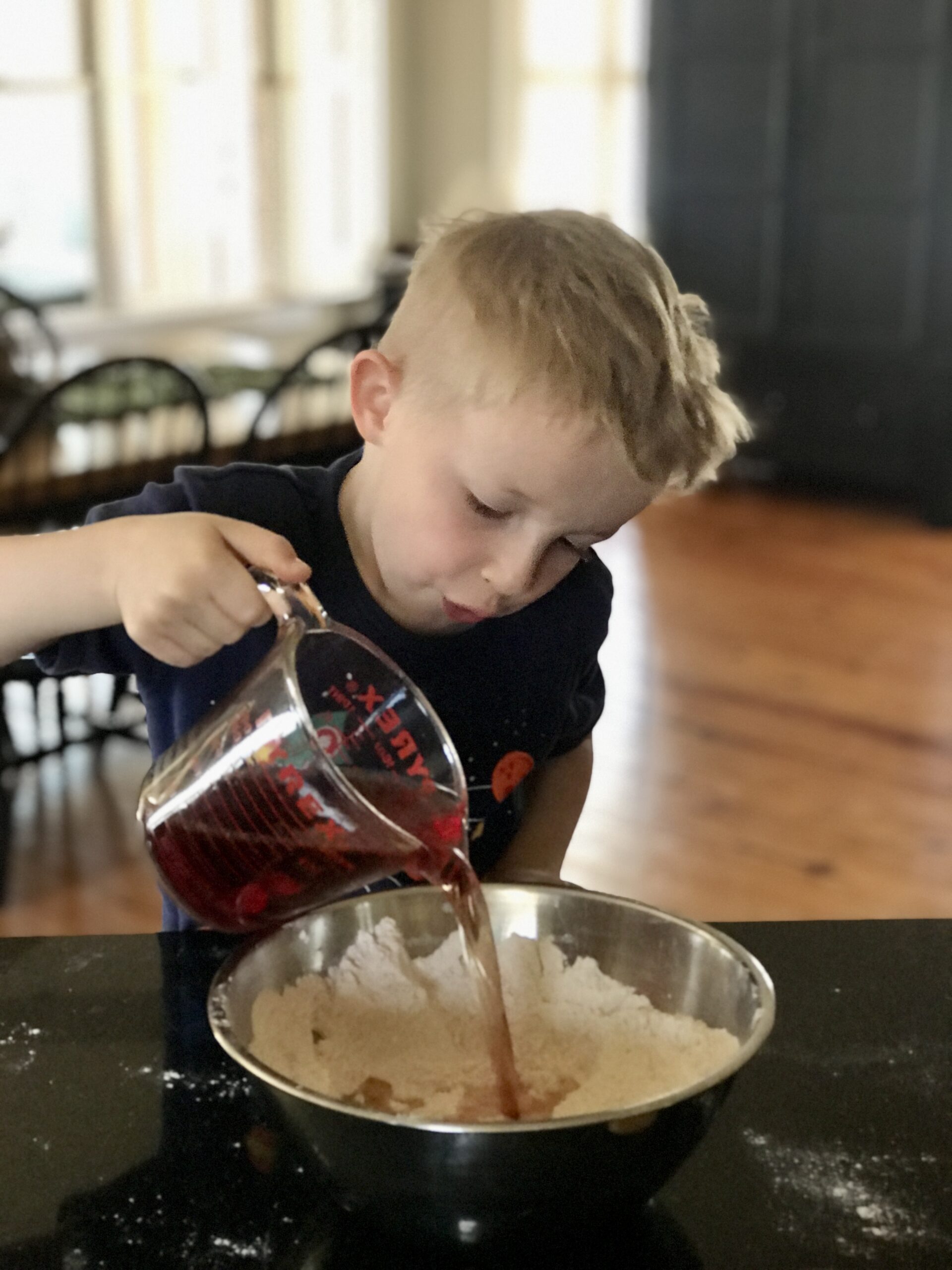 adding the liquid ingredients to the scentsational playdough