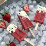 3 strawberries & cream pops on ice