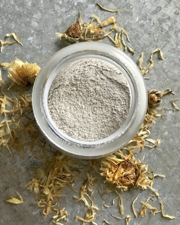 calming baby powder on a calendula petals