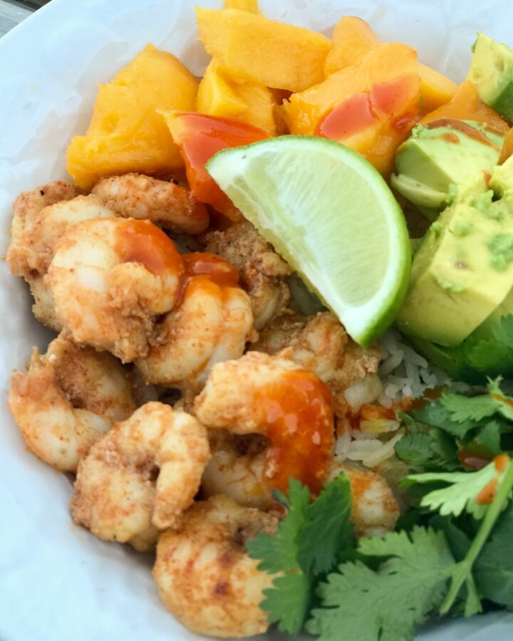 a close up bowl of spicy shrimp and mango
