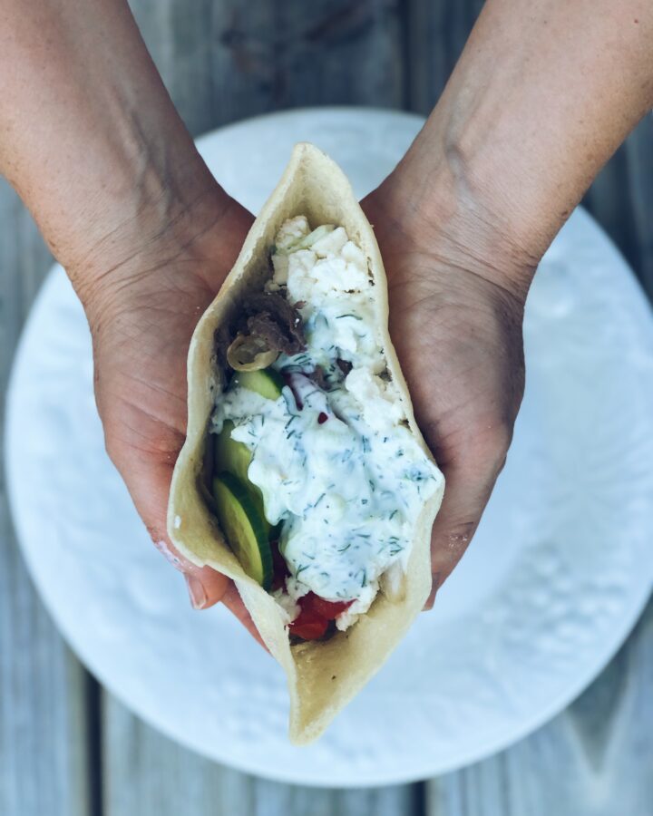 hands holding a gyro