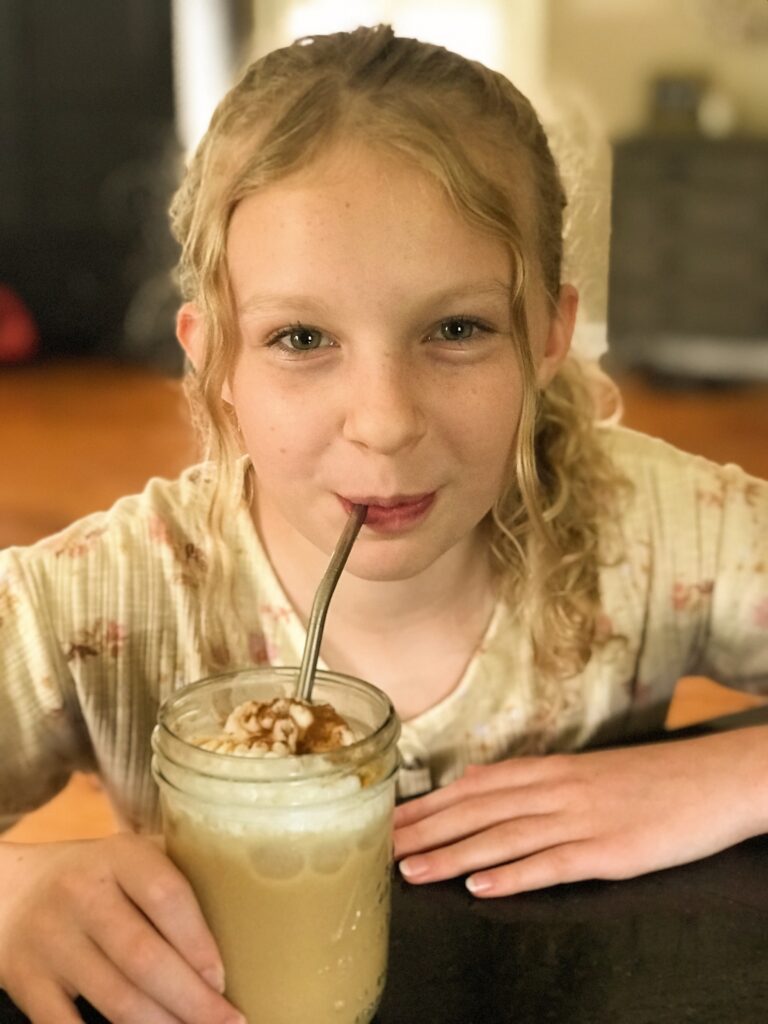 Abby drinking a Caramel Frappuccino