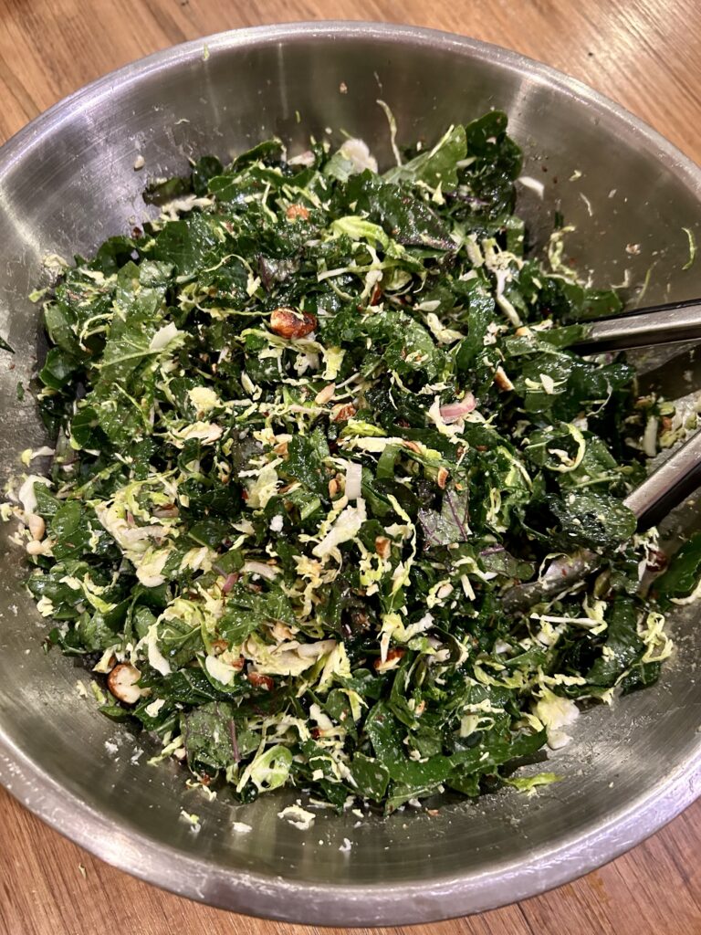 a giant bowl of kale & Brussels sprout salad with toasted almonds