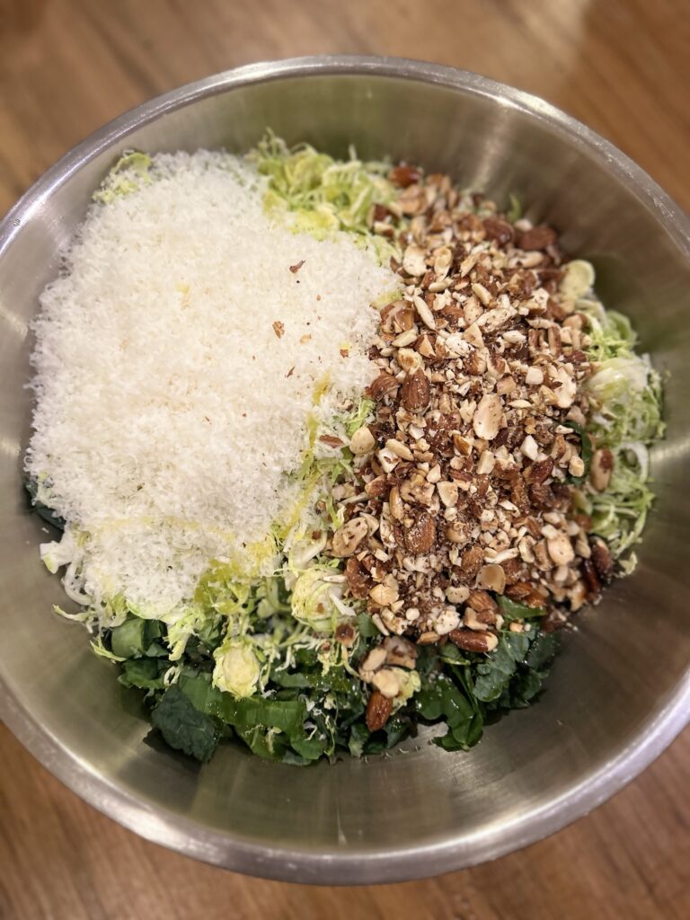 the elements of a kale & Brussels sprouts salad before mixing
