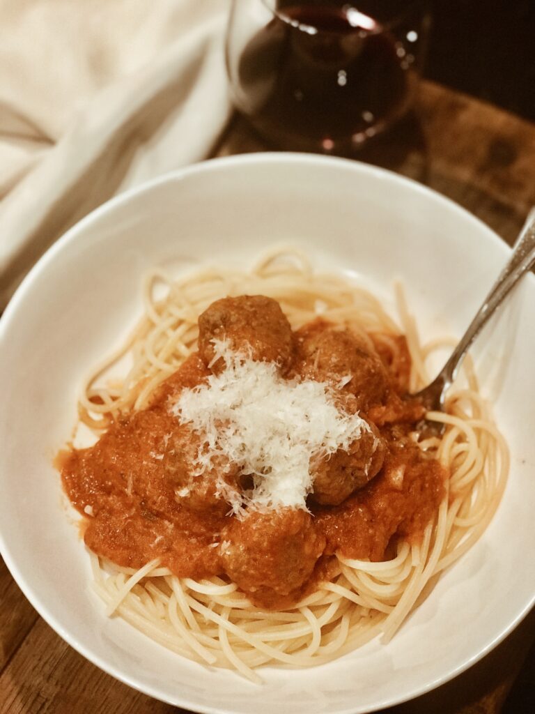 a bowl of spaghetti and meatballs