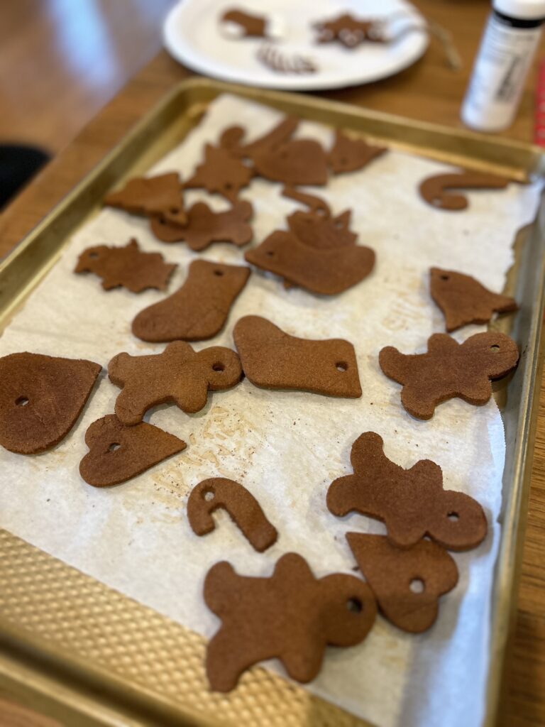 tray of homemade cinnamon Christmas cutouts