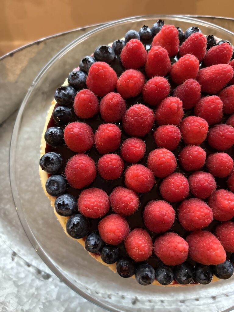 cheesecake up close with fresh berries