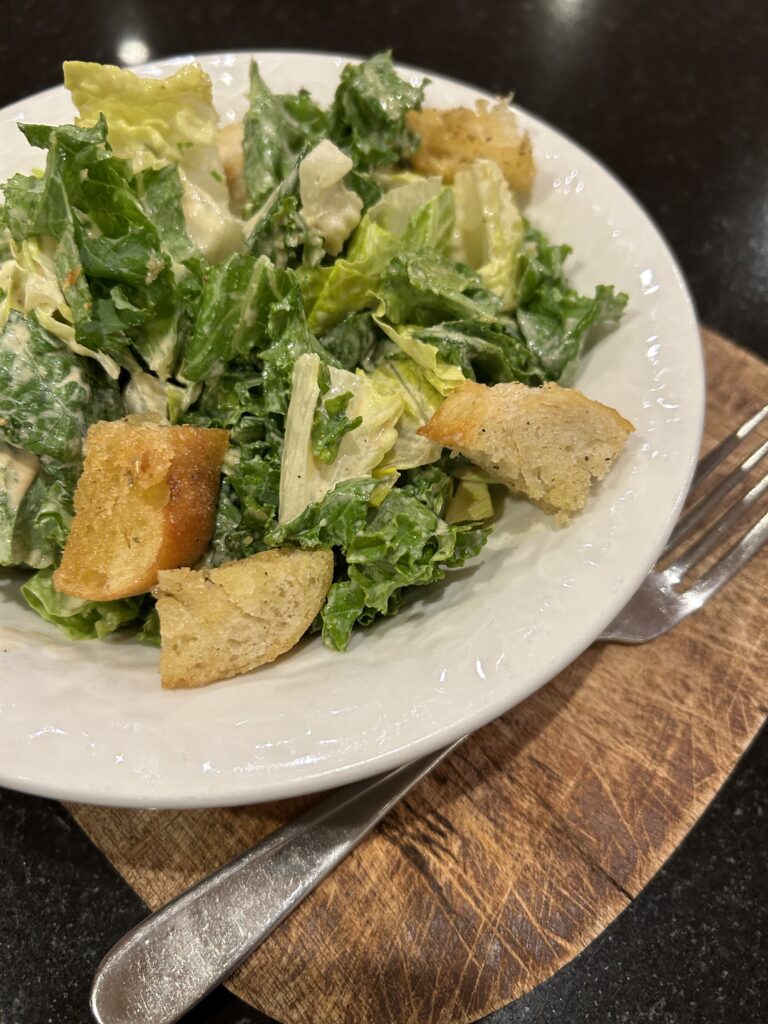 a bowl of Kale & Romaine Caesar salad 