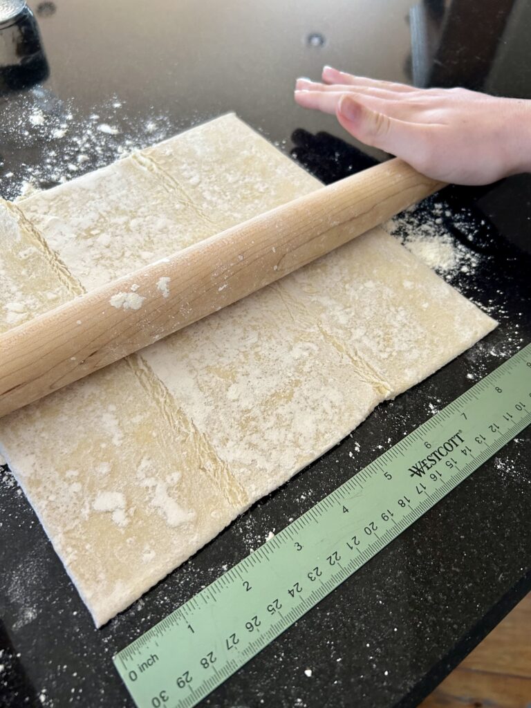 rolling out puffed pastry dough