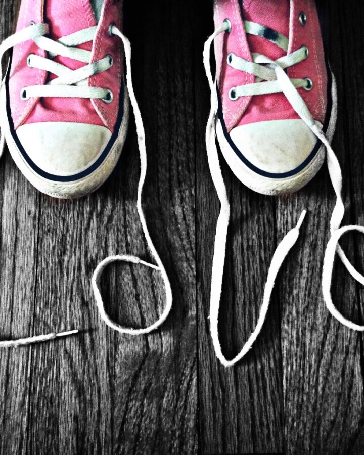pink converse shoes with the laces spellling the word love